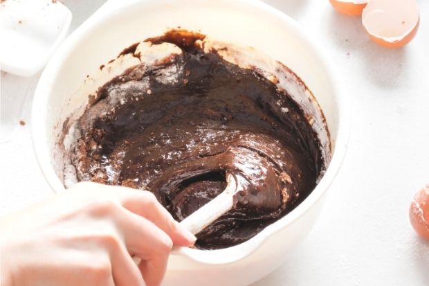 Brownie mix being stirred after chef learned what to do if you added too much water to brownie mix