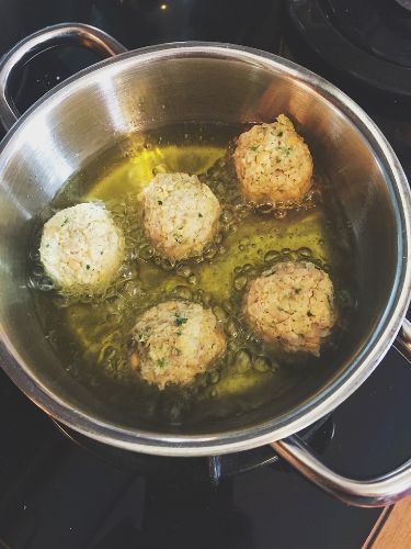 Falafel frying in pan after chef learned how to keep falafel from falling apart