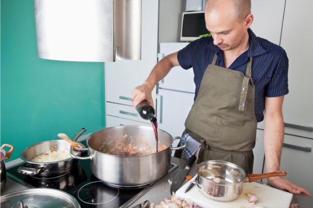 Man pouring red wine in Bolognese pot instead of using substitute
