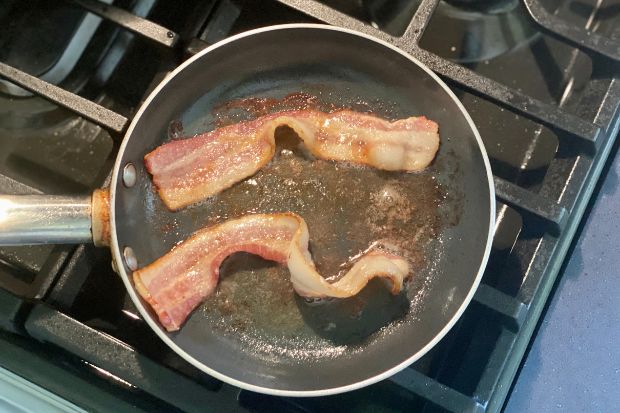 Bacon frying in pan after chef learned if you need to oil the pan for bacon
