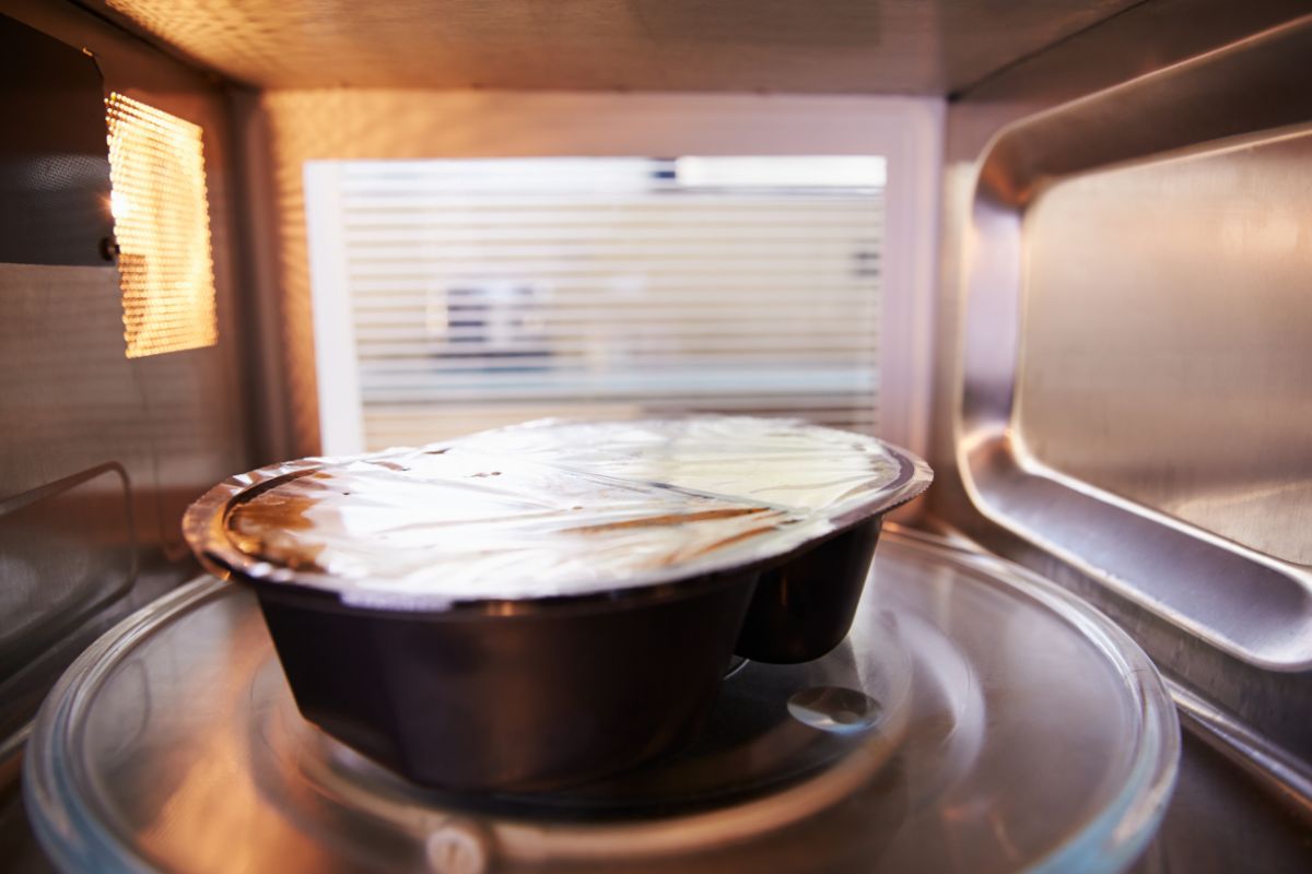 Container of food spinning in the microwave