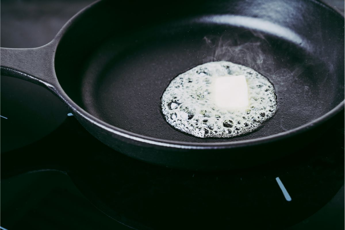 Butter melting in a cast iron skillet