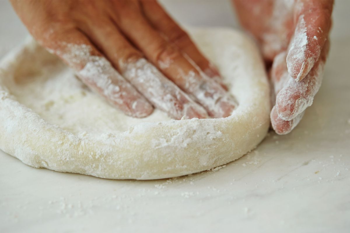 Shaping sticky pizza dough