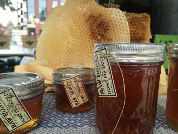 Jars of raw honey that can be used to tenderize meat